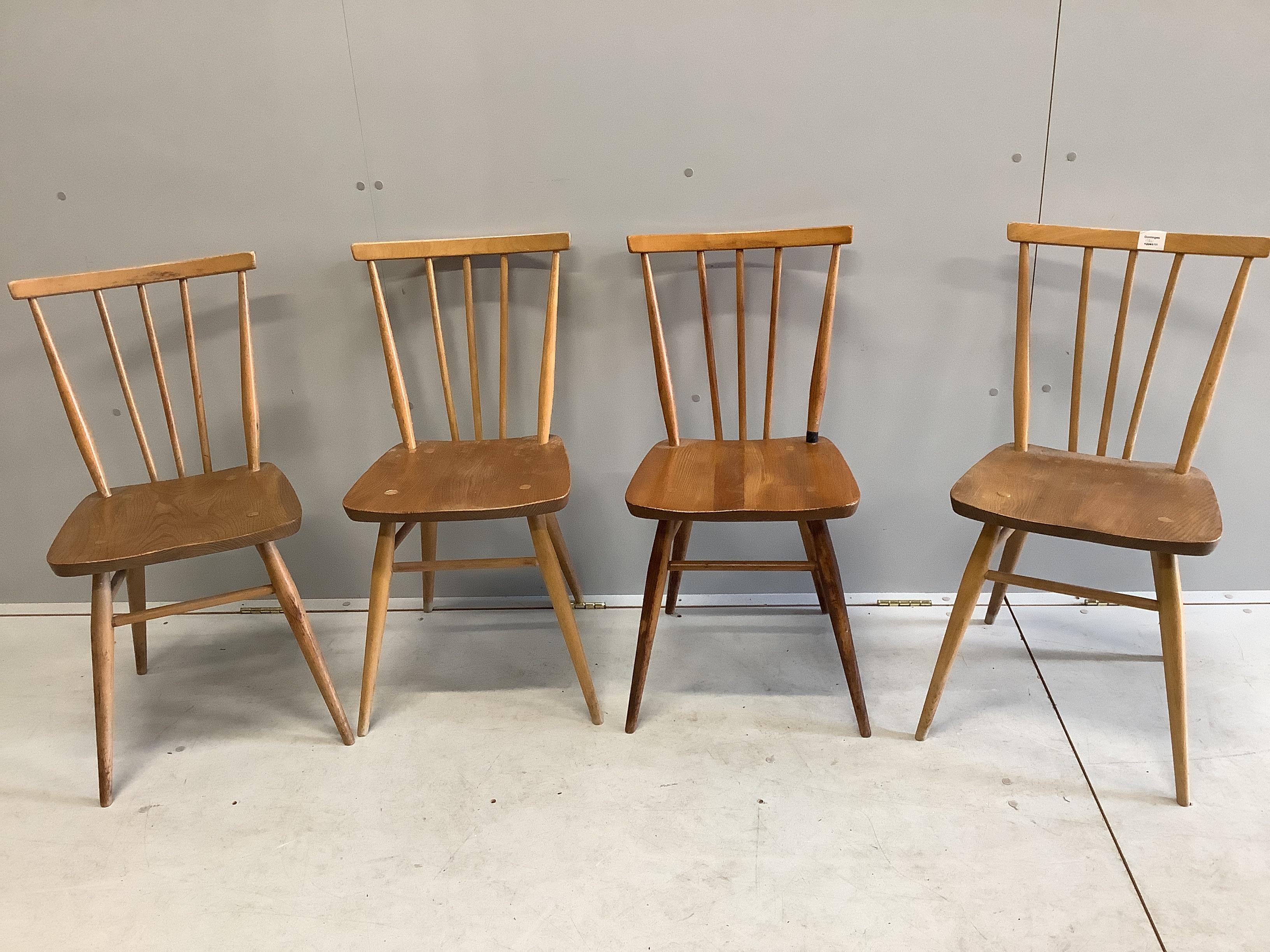 A set of four Ercol 391 elm and beech comb back dining chairs